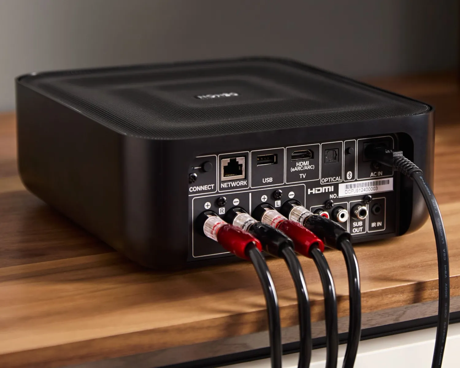 Rear panel of the Denon Home Amp with speaker and HDMI cables connected
