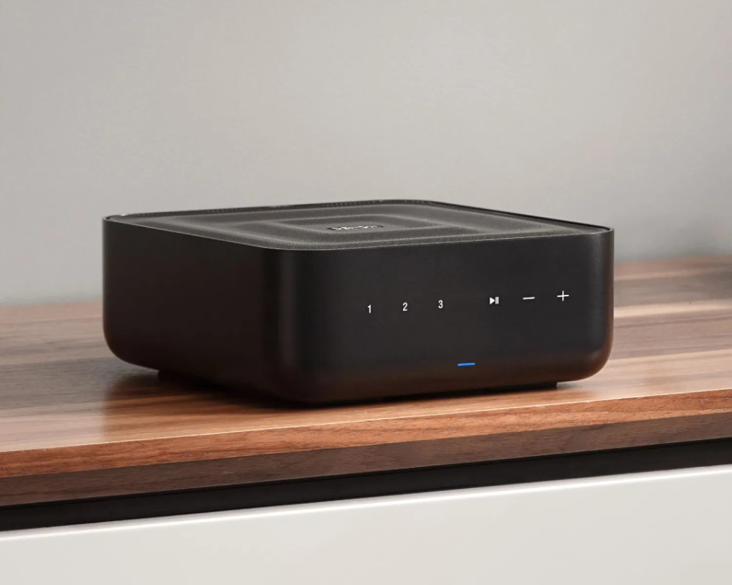 Denon Home Amp on a timber shelf in a living room